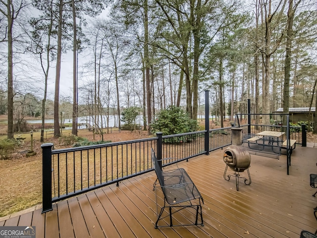 wooden terrace with a water view