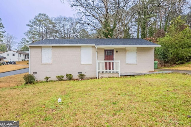 ranch-style home with a front lawn