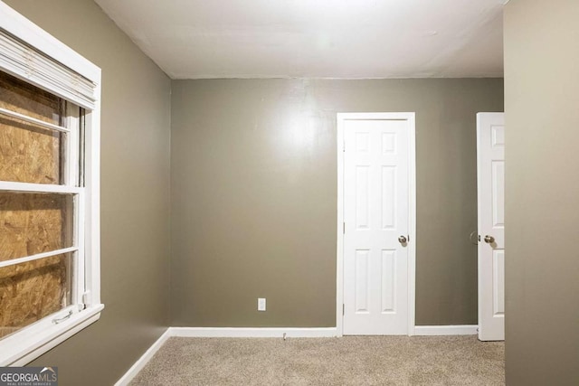 unfurnished room with carpet floors