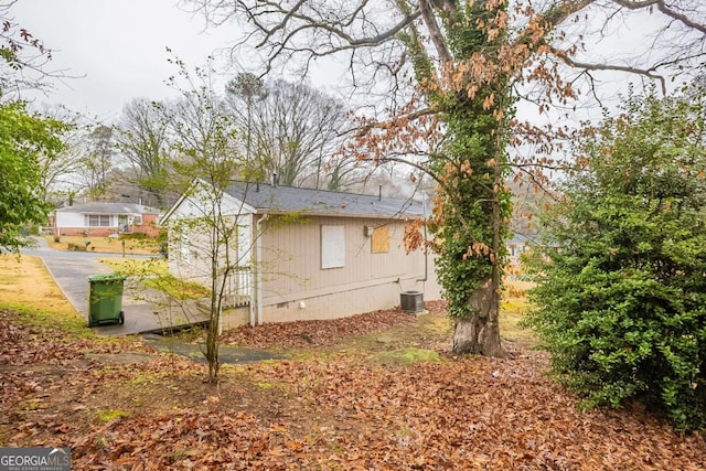 view of side of property with cooling unit