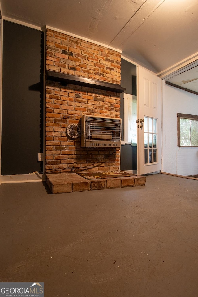 unfurnished living room with concrete flooring