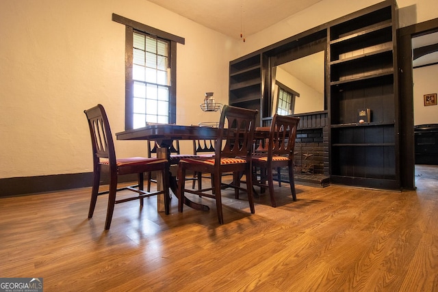 dining space with hardwood / wood-style flooring