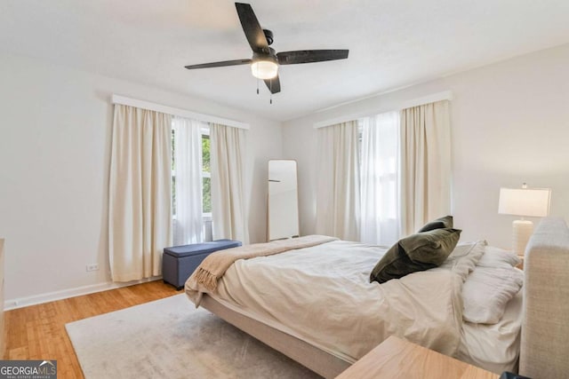 bedroom featuring light hardwood / wood-style flooring and ceiling fan