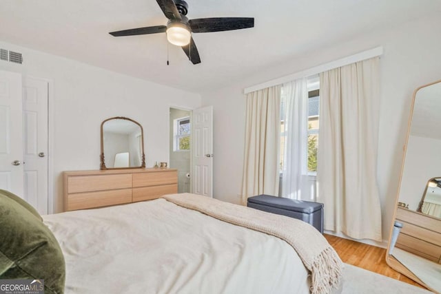 bedroom featuring ceiling fan and light hardwood / wood-style floors