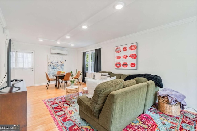 living room featuring hardwood / wood-style flooring, crown molding, and a wall mounted AC