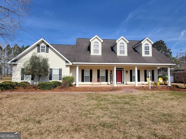 view of front of property with a porch and a front lawn