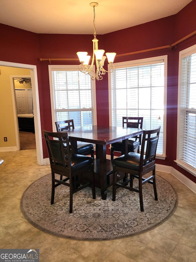 dining room with a notable chandelier