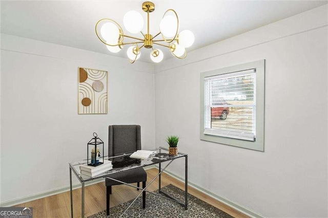 office space with a notable chandelier and hardwood / wood-style flooring