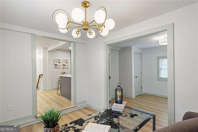 interior space featuring a chandelier and light hardwood / wood-style floors