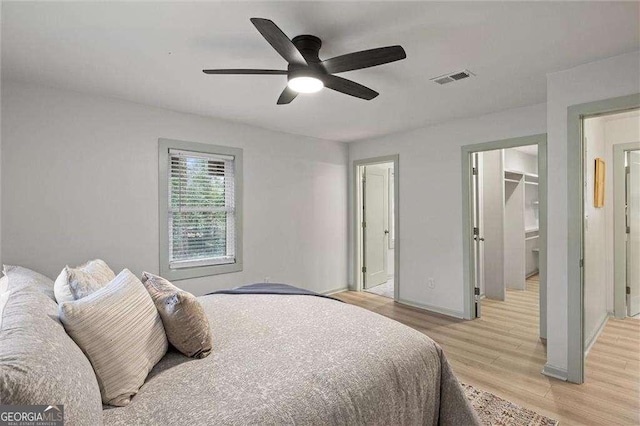 bedroom with light hardwood / wood-style flooring and ceiling fan