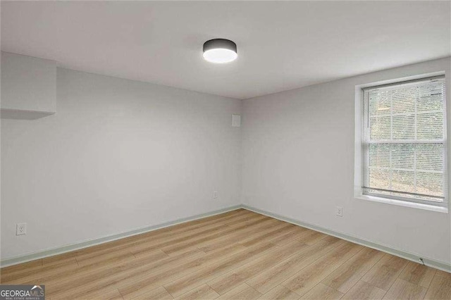 unfurnished room featuring light hardwood / wood-style floors