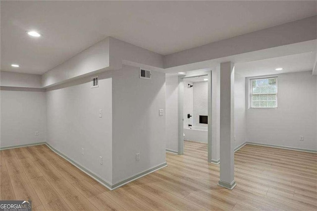 basement with light wood-type flooring