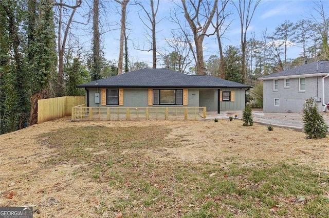 ranch-style home with a front lawn