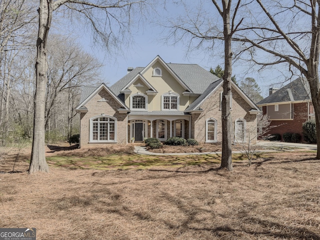 view of front facade with stucco siding and brick siding