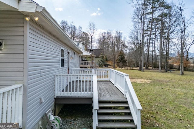 deck featuring a lawn