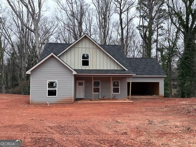 view of front of property with a garage and a porch