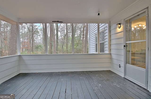 unfurnished sunroom featuring plenty of natural light