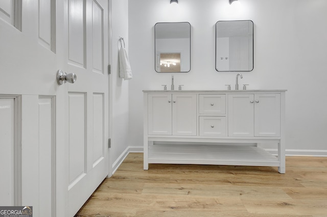 bathroom featuring vanity and hardwood / wood-style floors