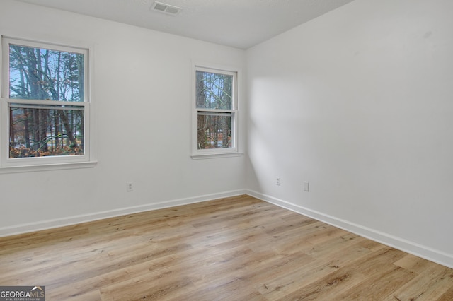 empty room with light wood-type flooring