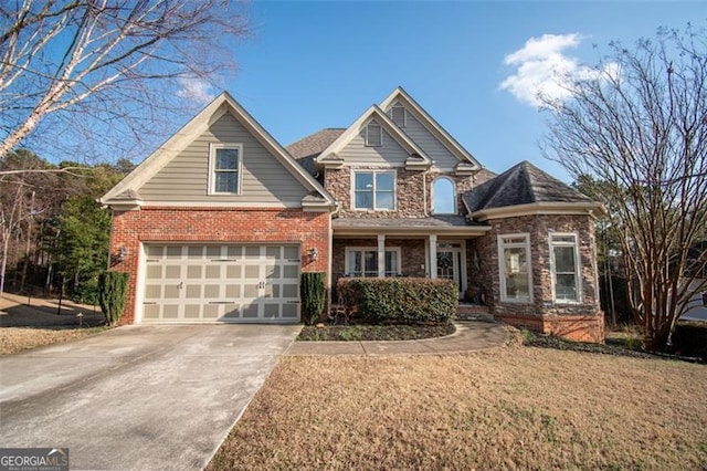 view of front of house with a garage and a front lawn