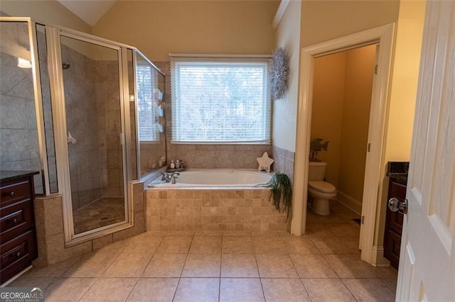 full bathroom featuring lofted ceiling, vanity, toilet, and separate shower and tub