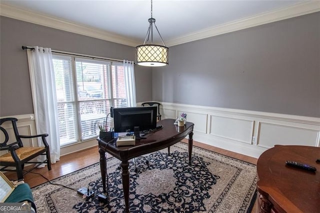 office area featuring crown molding, plenty of natural light, and hardwood / wood-style floors