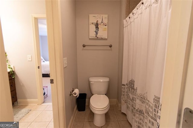 bathroom with tile patterned floors and toilet