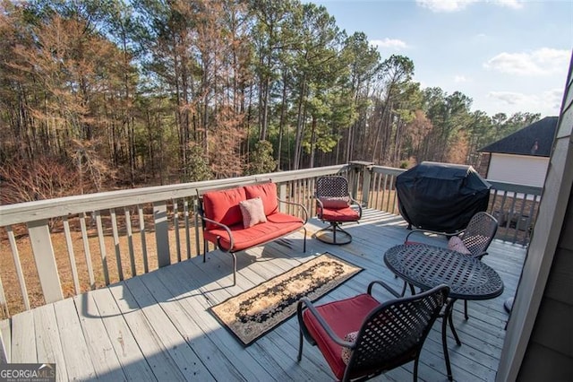 wooden terrace featuring grilling area