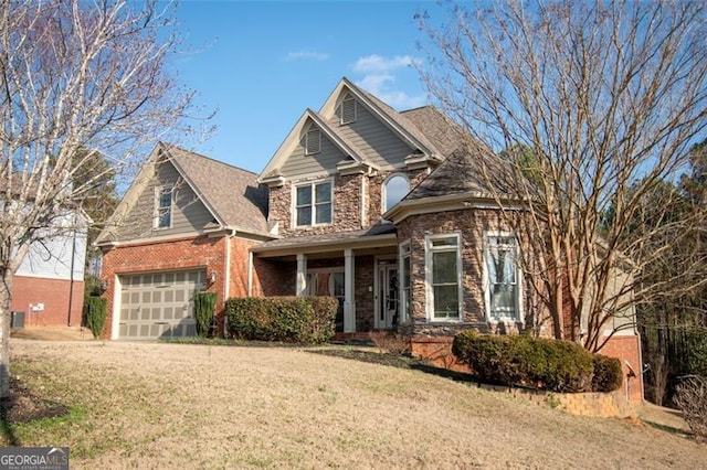 view of front of house with a garage and a front lawn