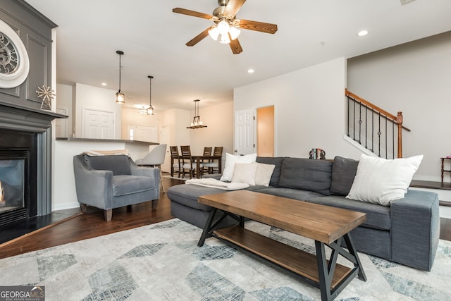 living room featuring hardwood / wood-style flooring and ceiling fan