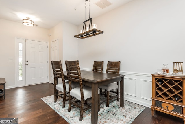 dining room with dark hardwood / wood-style floors