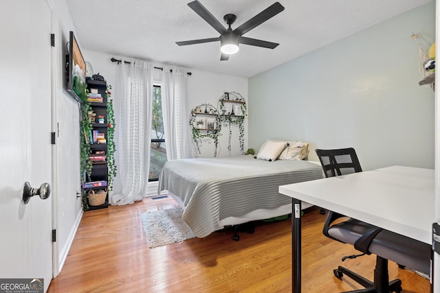 bedroom featuring light hardwood / wood-style floors and ceiling fan