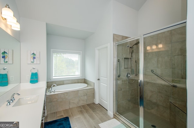 bathroom with independent shower and bath and vanity