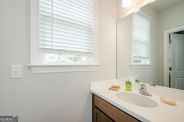 bathroom with plenty of natural light and vanity