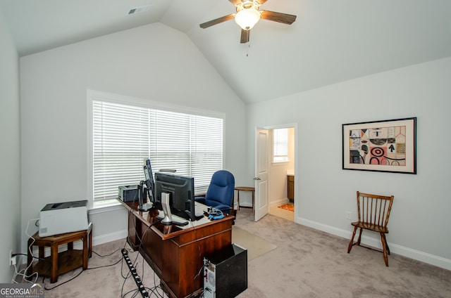 carpeted office with lofted ceiling and ceiling fan