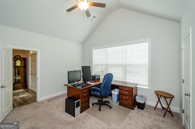 home office with lofted ceiling, light colored carpet, and ceiling fan