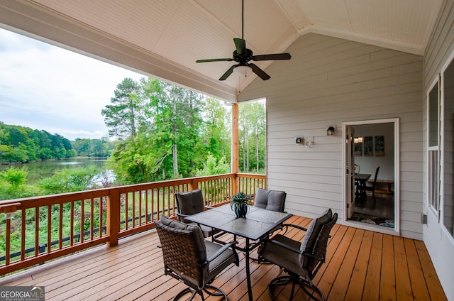 wooden terrace featuring ceiling fan and a water view