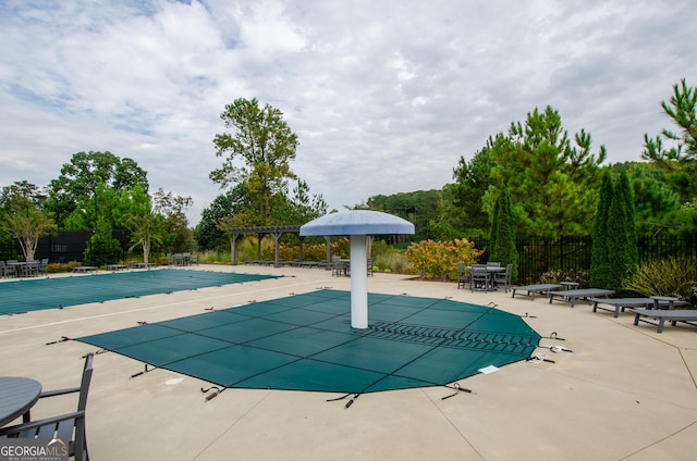 view of pool featuring a pergola and a patio