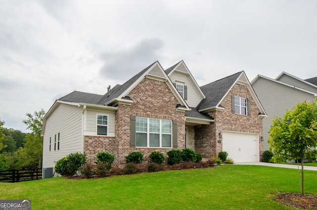 view of front of property with a garage and a front lawn