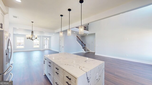 kitchen with visible vents, stainless steel fridge with ice dispenser, open floor plan, white cabinets, and dark wood-style flooring