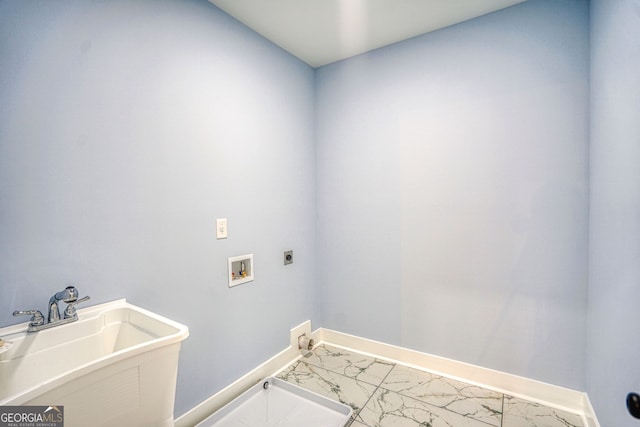 clothes washing area with laundry area, marble finish floor, hookup for an electric dryer, and a sink