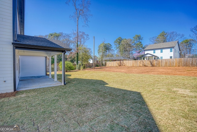 view of yard featuring a patio and a fenced backyard