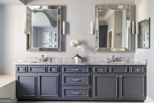 bathroom featuring ornamental molding and vanity