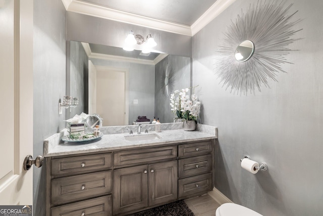 bathroom with vanity and crown molding