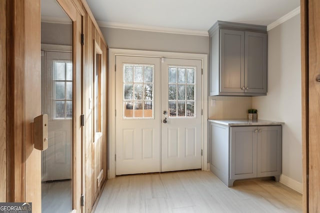 doorway featuring crown molding and french doors