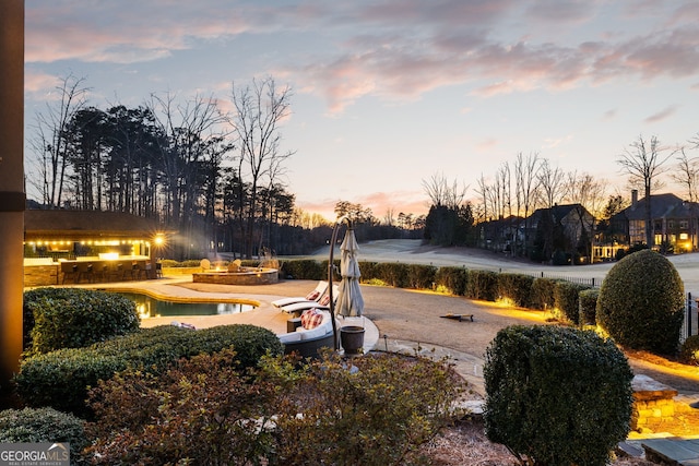 view of yard at dusk