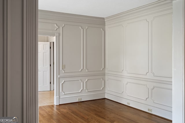 interior space featuring dark wood-style floors and a decorative wall