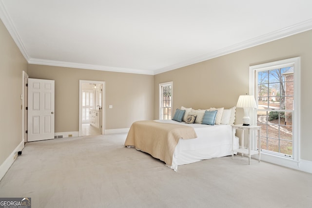 bedroom with ornamental molding, light colored carpet, and baseboards