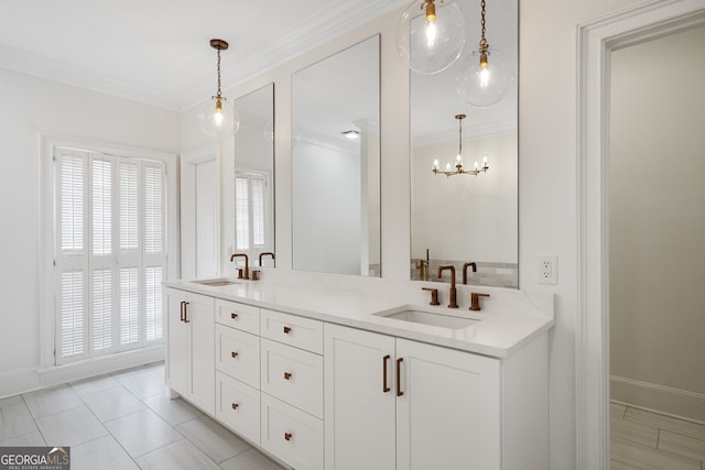 bathroom with baseboards, double vanity, a sink, and crown molding