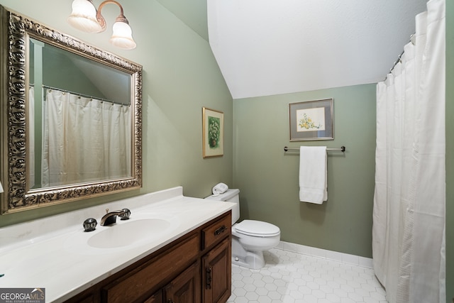 full bathroom featuring tile patterned flooring, toilet, vanity, baseboards, and vaulted ceiling